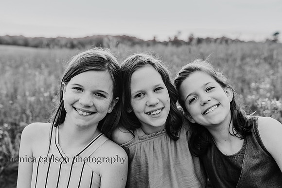 three smiling sisters