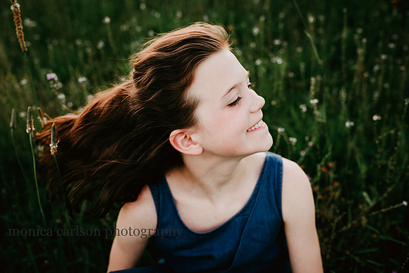 portrait of brunette girl waving her hair