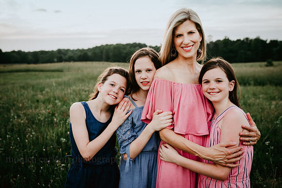 portrait of a mother with her three young daughters