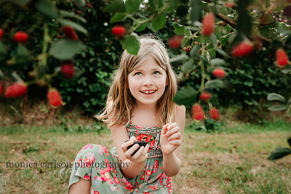 portrait of a smiling girl about top pick berries by monica carlson photography