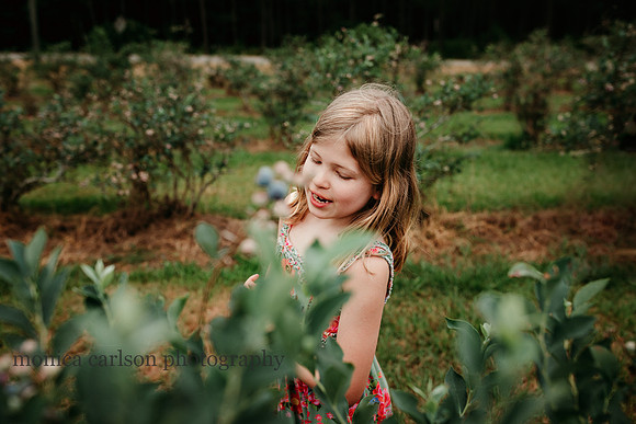 blonde girl walking by berries