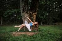 ballerina in a tutu swinging on a tree swing at prospect farms