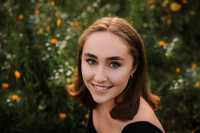 portrait of a teen girl surrounded by wildlfowers