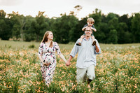 family in a wildflower field by monica carlson