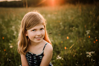 smiling girl on a wildflower field
