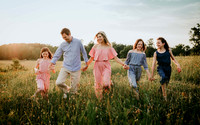 family walking in a wildflower field at prospect farms