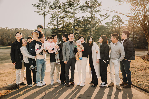 Large extended family laughing together