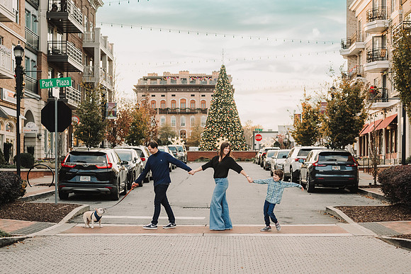 Family of three and their dog cross the street in downtown Alpharetta