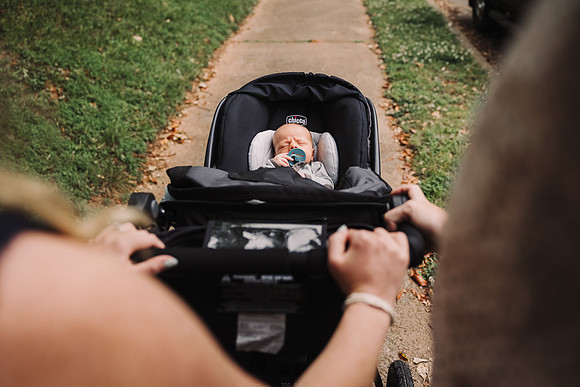 baby in a stroller on a walk