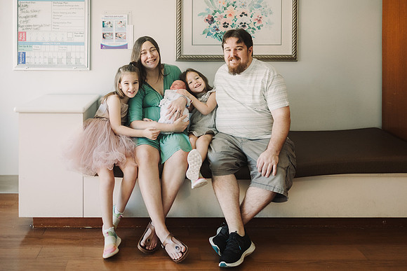 Proud new family of five in the maternity ward