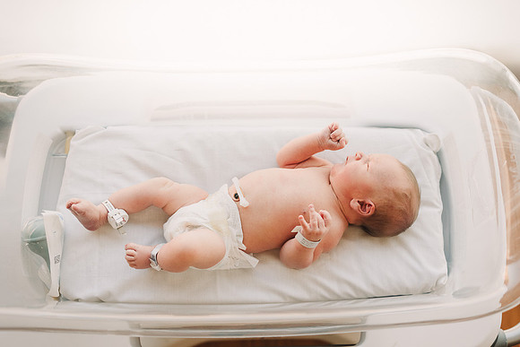 Baby in a hospital bassinet