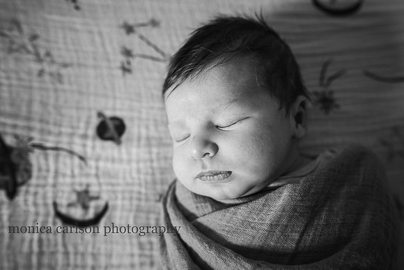 Black and white portrait of a sleeping newborn