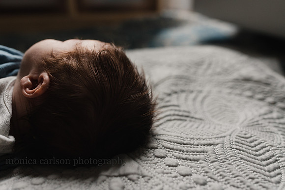 Newborn baby with a head full on dark hair