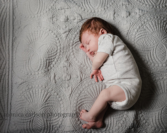 newborn baby sleeping on his side at home in Atlanta