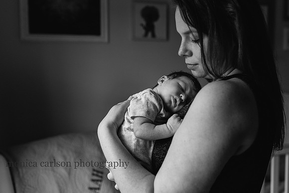 dramatic portrait of a mother holding her baby boy by monica carlson photography