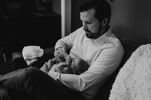 dad feeds baby