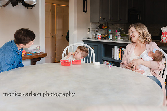 Family enjoying chick fil a in their home