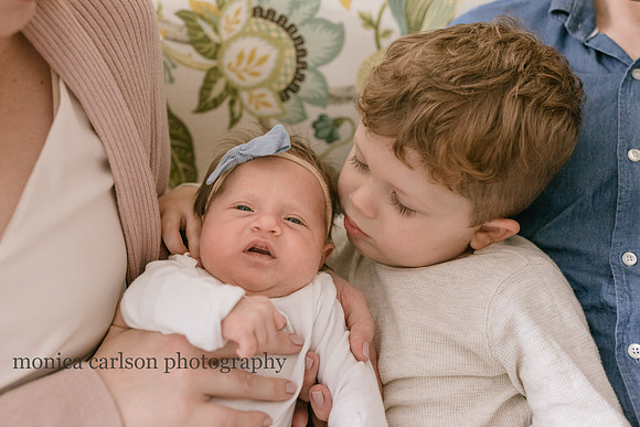 young boy looking at his new sister in his home outside Atlanta