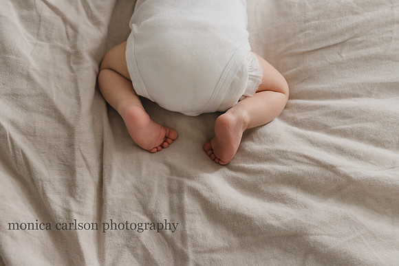 sweet baby feet on a bed in its home