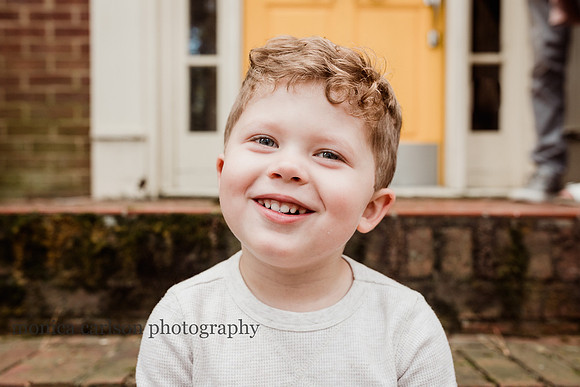 portrait of a happy little boy by monica carlson