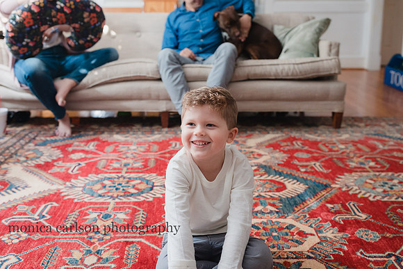 boy sitting on the floor of his living in Alpharetta