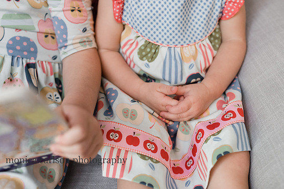 Detail photo of a small girls hands clasped together