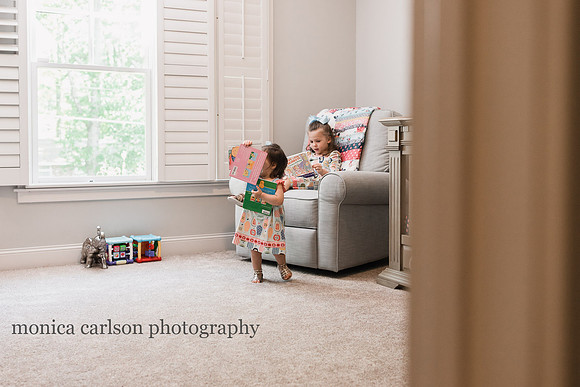 sisters playing at home during a family photo session with Monica carlson