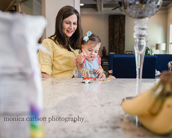 mother and daughter having a snack during a photo session at their home in alpharetta