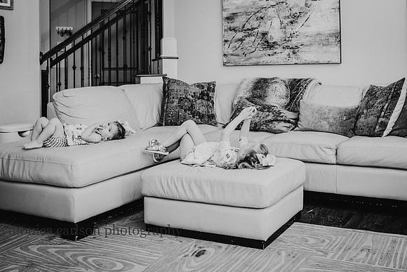 little girls resting on a couch in their living room