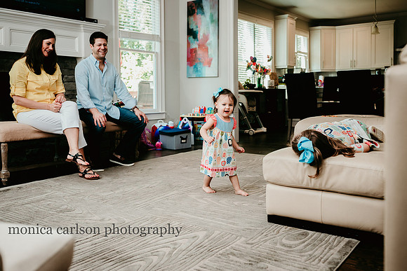 family watching their girls dance during a family photo session