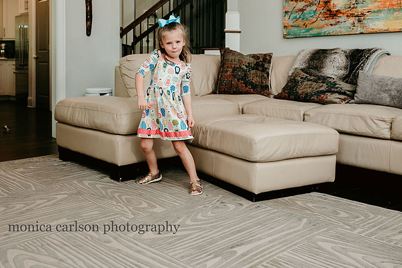young girl dancing at home during a lifestyle session