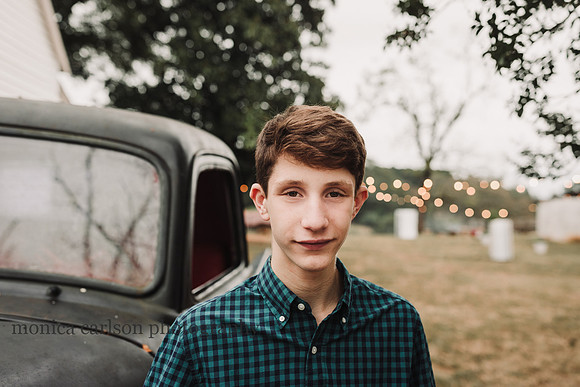 happy portrait of a young man on a farm