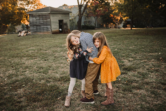 three sweet siblings hugging at Barrington Hall