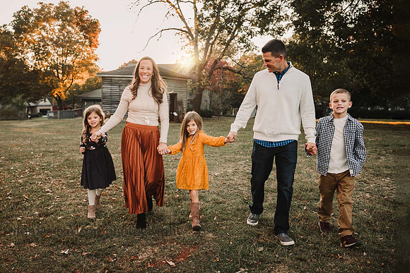 Family taking a sunset stroll on the property of Barrington Hall