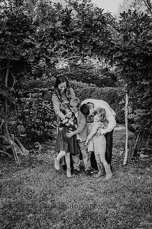 Family hugging each other in the gardens at Barrington hall