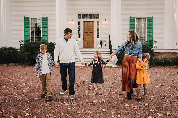 portrait of a family walking together in Roswell, GA