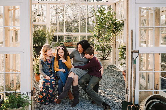 Mother and her children talking in a greenhouse in duluth, GA