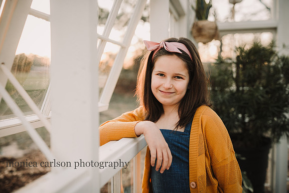 portrait of a little girl in a greenhouse at prospect farms
