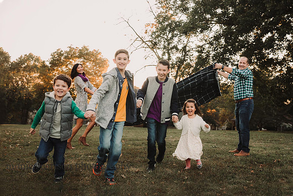 four kids running and having fun at a family photo session with Monica carlson