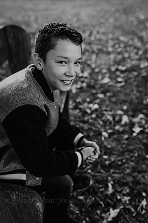 black and white portrait of a smiling teenage boy