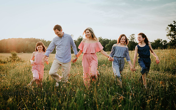 family walking in a flower field at Prospect farms