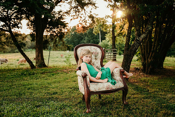girl sitting regally on a chair at milford family farm by monica carlson photography