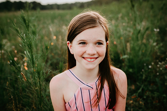 portrait of a happy brunette tween girl at Prospect farms