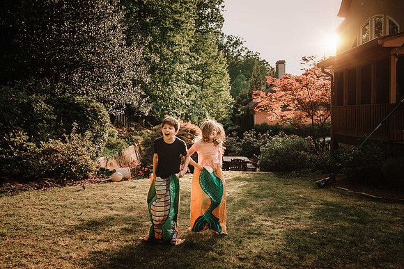 boy and girl having a sack race by monica carlson photography