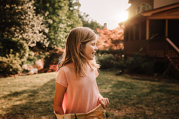 profile of a girl after a back yard sack race by monica carlson