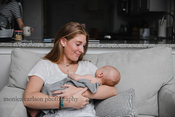teenager holding her newborn brother