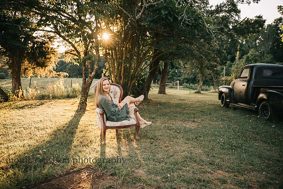 alpharetta teen sitting in a antique chair on a farm by monica carlson photography
