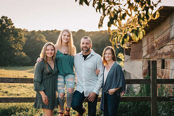 family of four portrait on a farm in cumming, GA