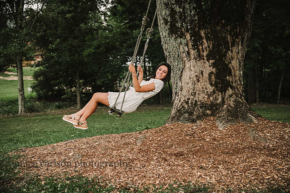 senior girl on a tree swing during a photo session