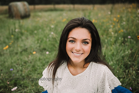 portrait of a teen girl in a wild flower field